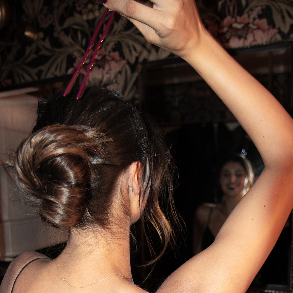 Backstage, pinning an updo with a Day Rate Beauty Power Pin